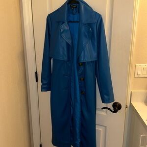 This gorgeous faux leather blue trench with amazing details is g stunning
